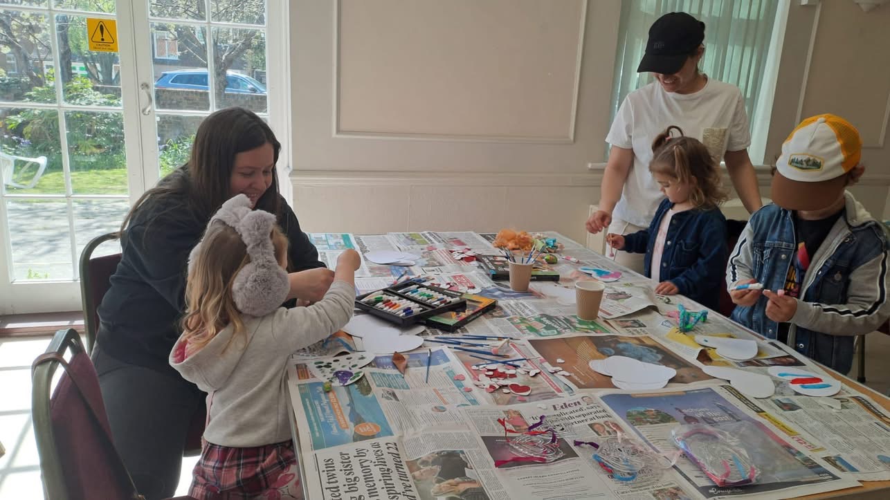 Children Painting on Heart Shaped Pieces of Paper
